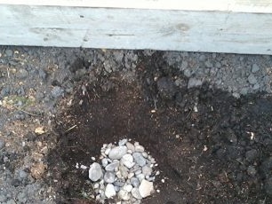 Pour large gravel to the bottom as drainage