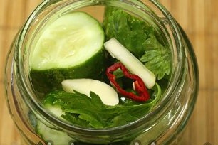 put the cucumbers in a jar