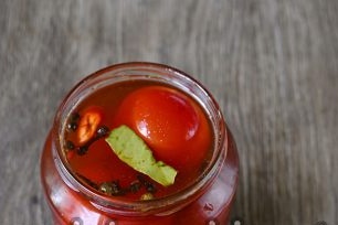 pour tomatoes with brine