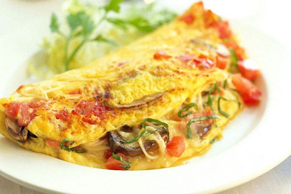 Omelet with sprat and tomatoes