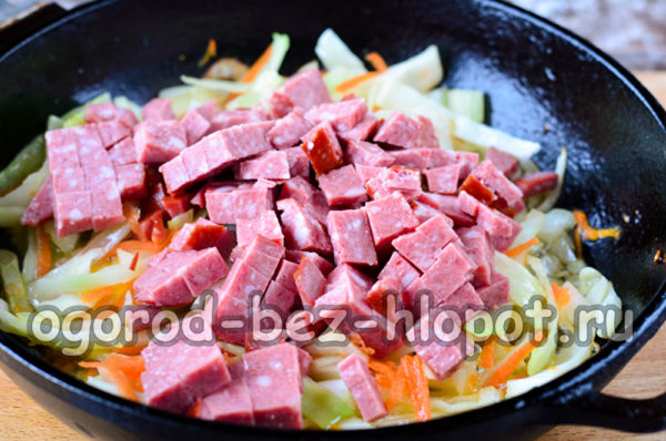 add sausage to cabbage