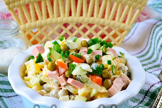 Olivier salad with sausage and fresh cucumber