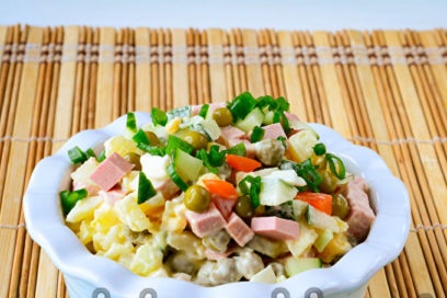 Olivier salad with fresh cucumber is ready