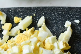boil eggs, peel and chop