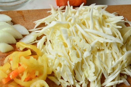 chop cabbage, chop peppers and onions